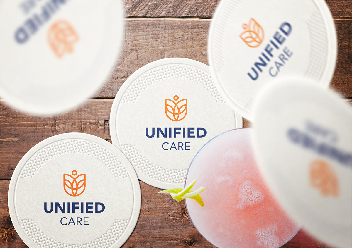 Unified Care logo on a coaster