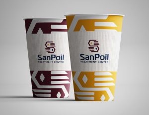 San Poil Treatment Center logo printed on a paper cup