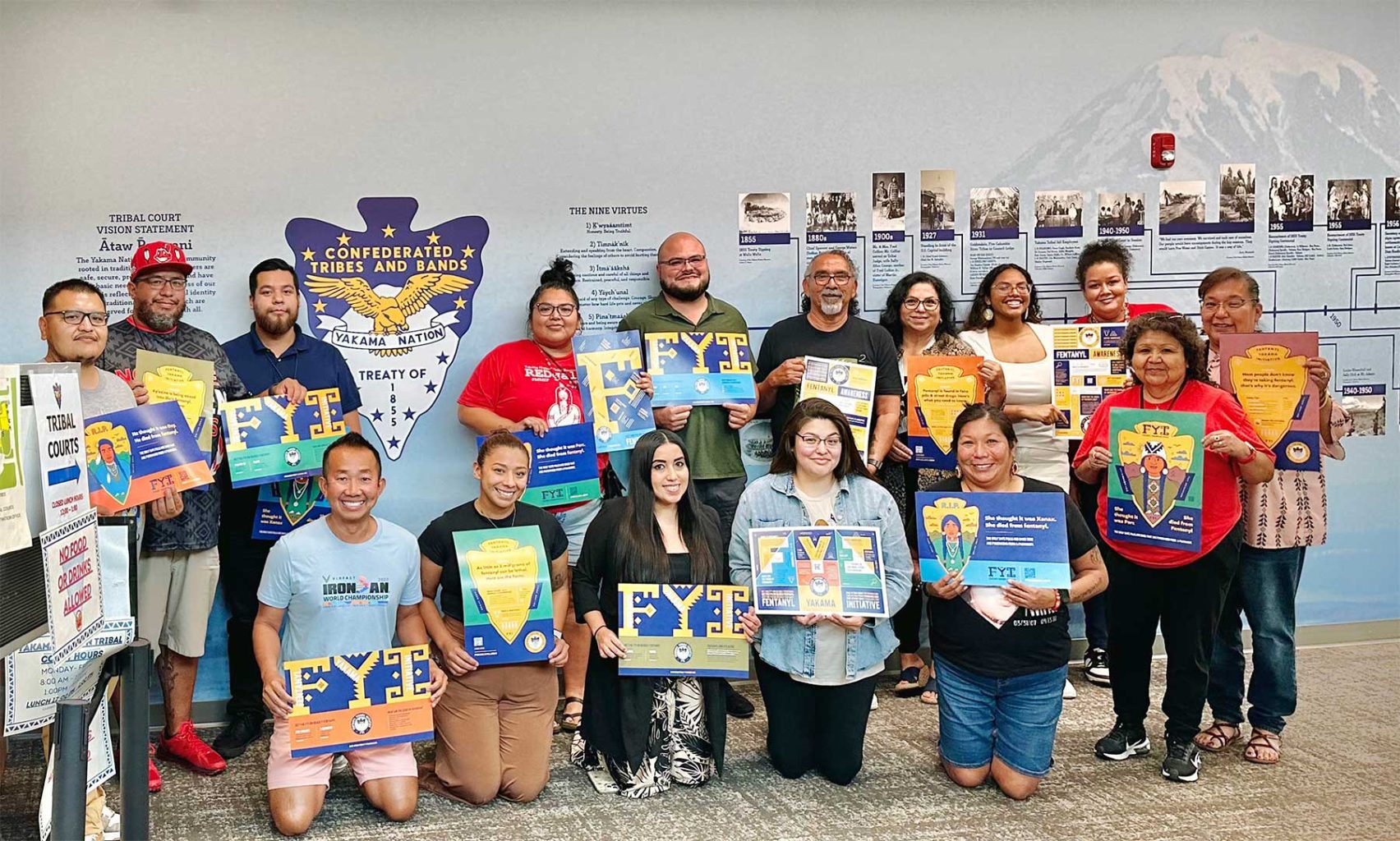 tran-creative-news-2025-09-yakama-nation-ben-with-tribal-members-holding-posters-edit-1